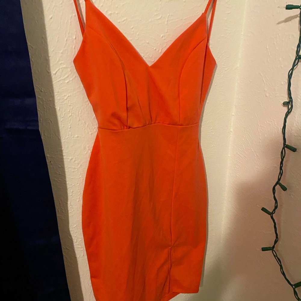 Peach colored open back dress with slit